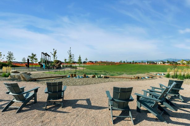 Adirondack chairs looking out over a park and open space in Windsor, Colorado